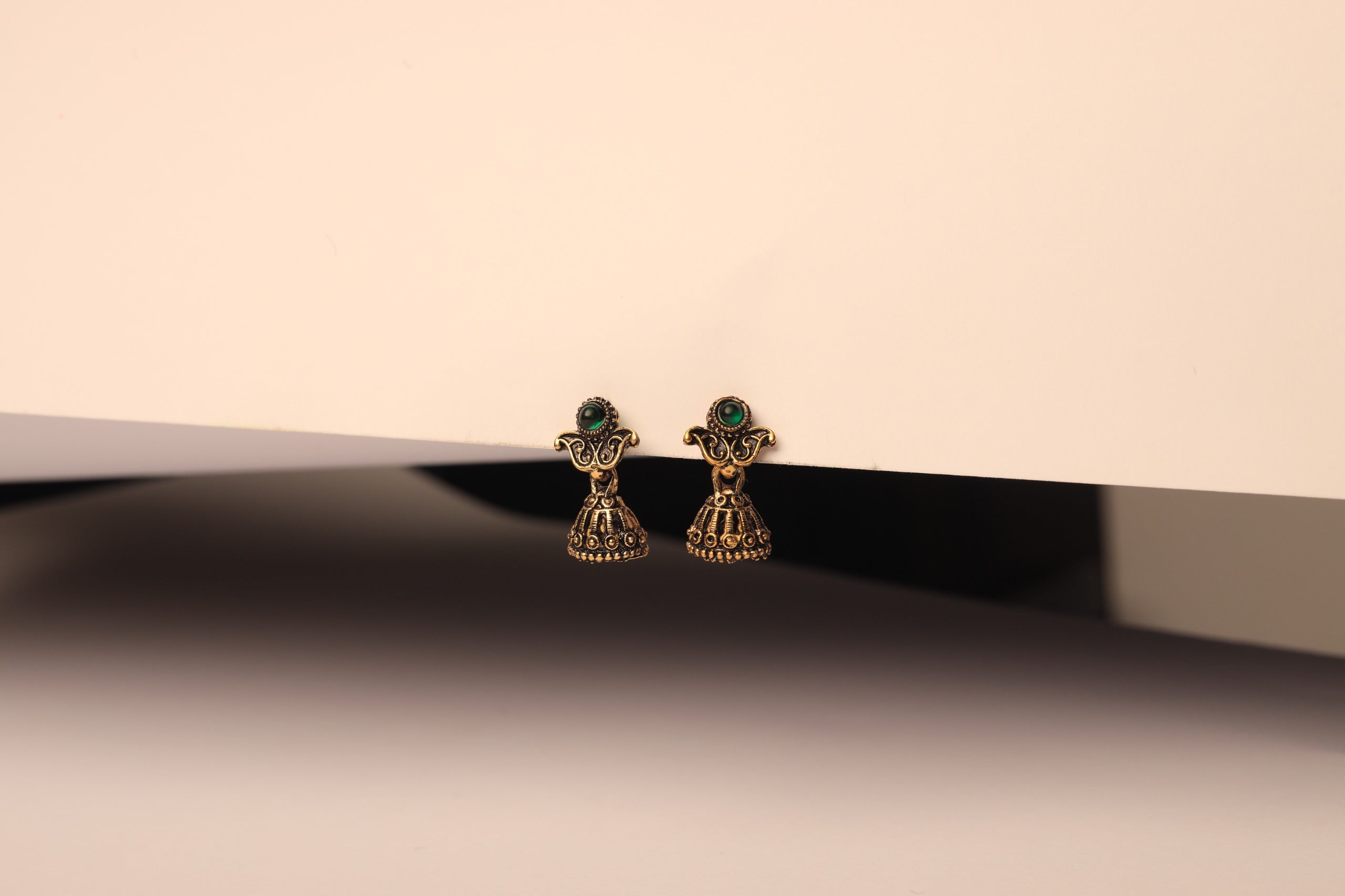 Royal Antique Jhumkas – Green Stone Charm